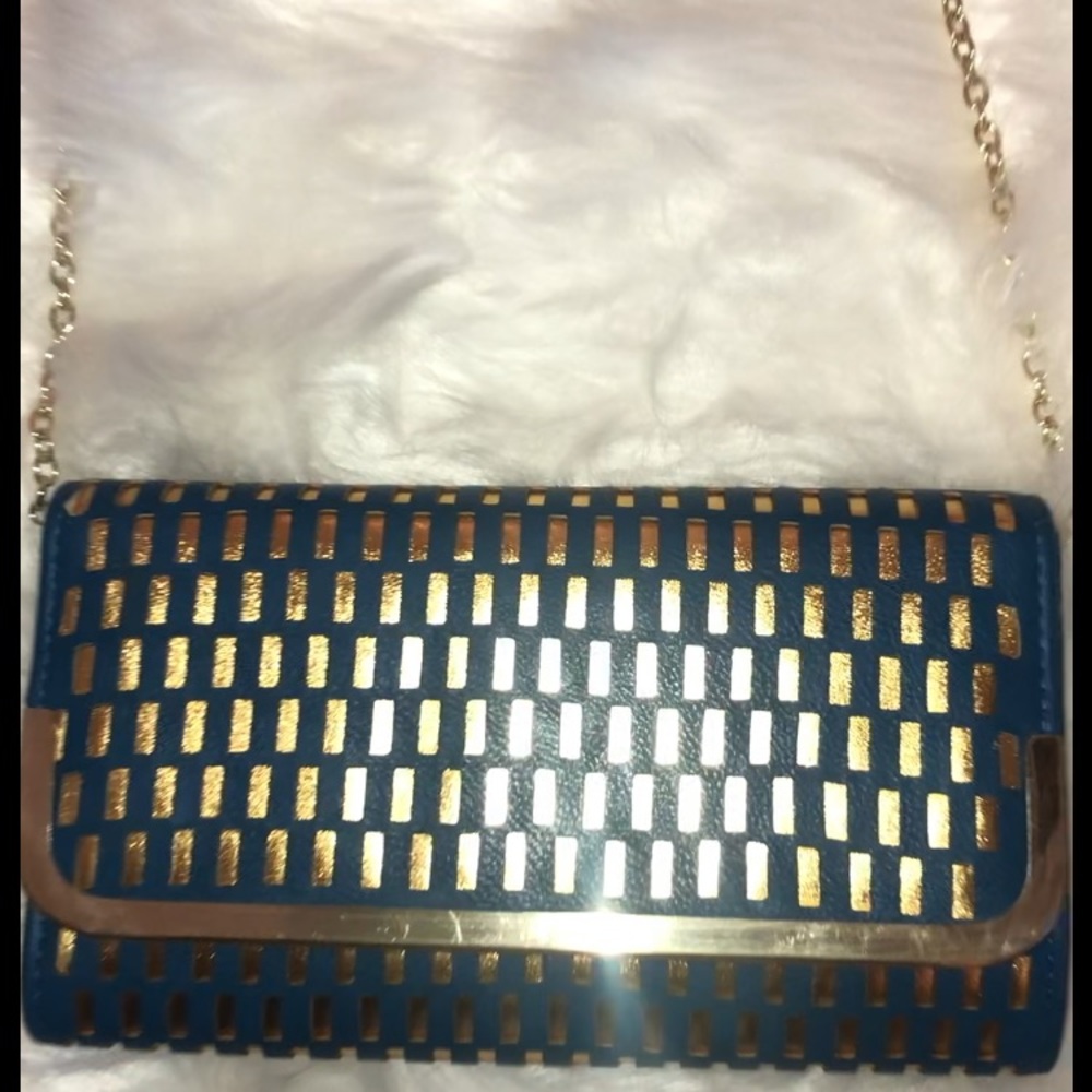 👇🏻$Reduced to lowest price. Stylish clutch in Pacific Blue With gold accent 😍
